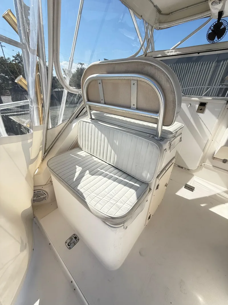 Slide: The Image of 2001 Albemarle 280 Express Sport Fisherman boat interior with cushioned seating and clear windows. - 12