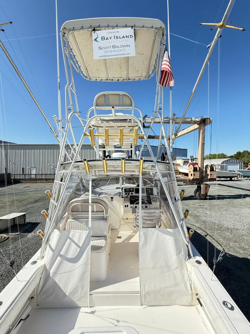 Slide: The Image of 2001 Albemarle 280 Express Sport Fisherman boat with diesel power, docked under clear blue sky. - 16
