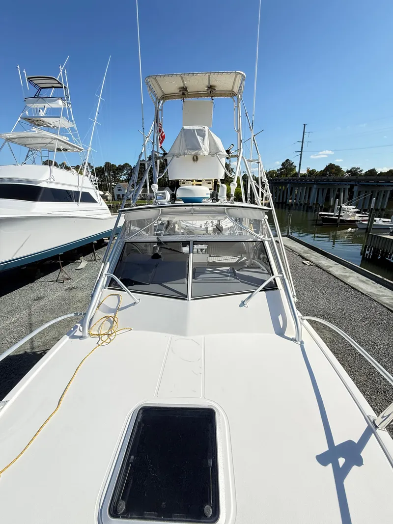 Slide: The Image of 2001 Albemarle 280 Express Sport Fisherman boat docked, featuring diesel power and sleek design. - 19