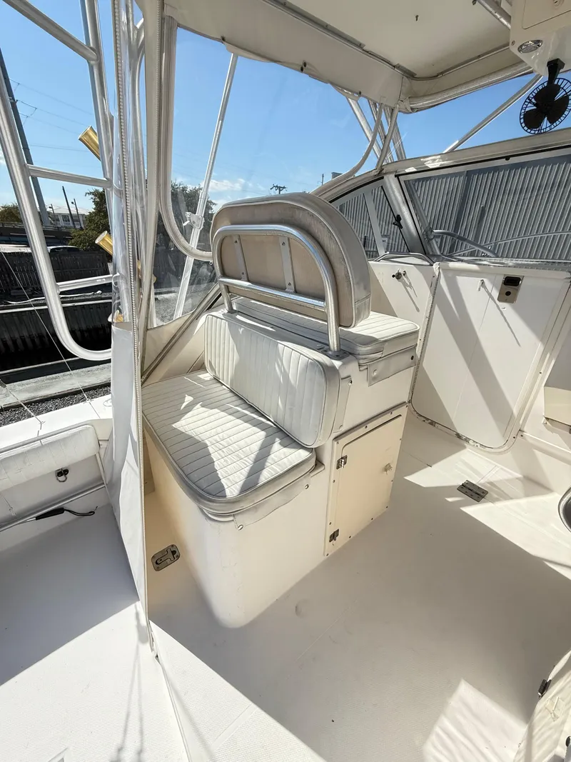 Slide: The Image of 2001 Albemarle 280 Express Sport Fisherman interior with seating and helm area. - 32