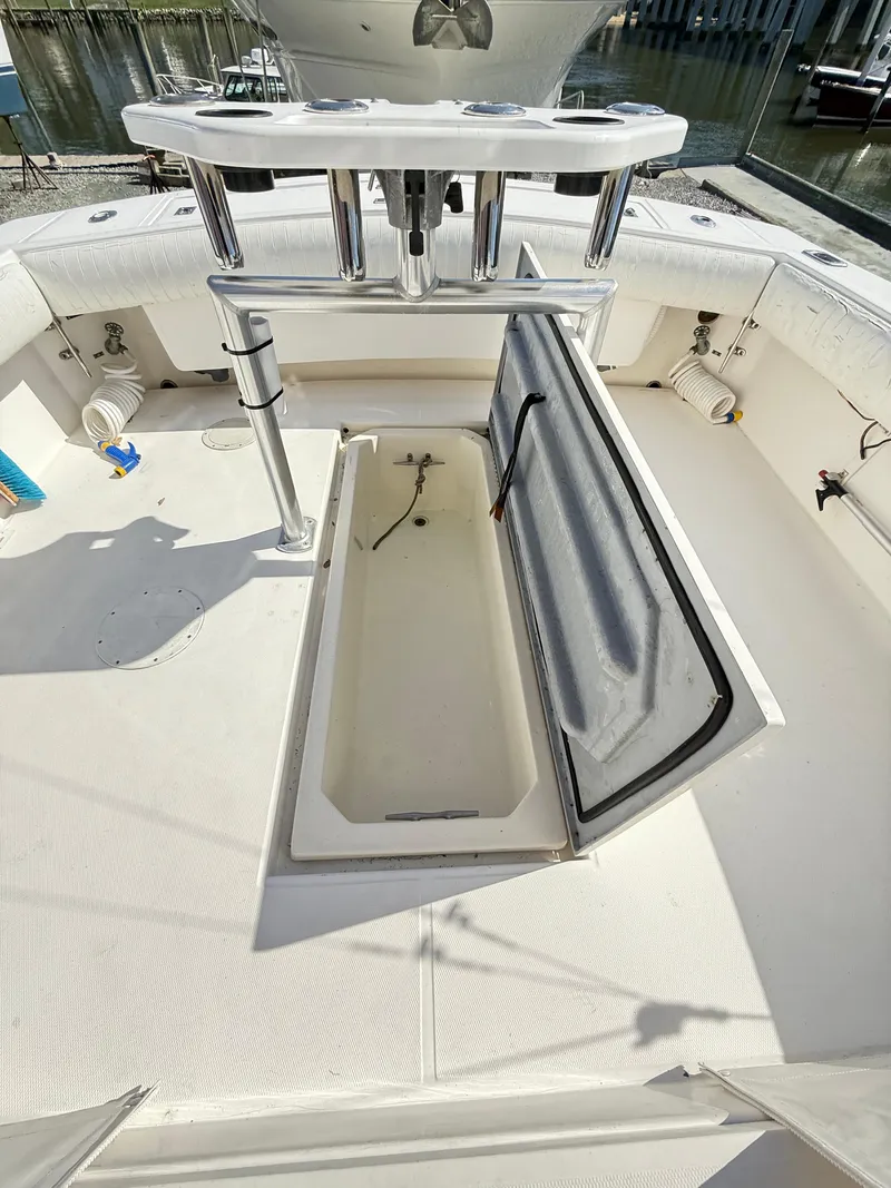 Slide: The Image of 2001 Albemarle 280 Express Sport Fisherman deck with open storage compartment. - 35