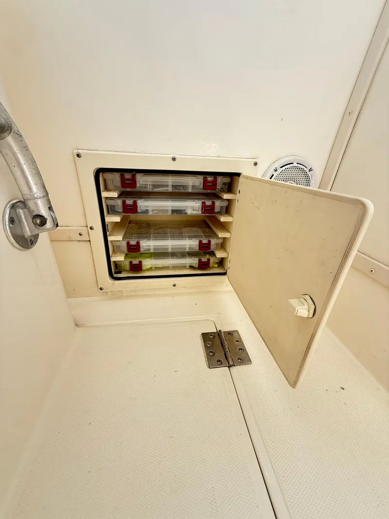 Slide: The Image of Storage compartment on a 2001 Albemarle 280 Express Sport Fisherman boat. - 36