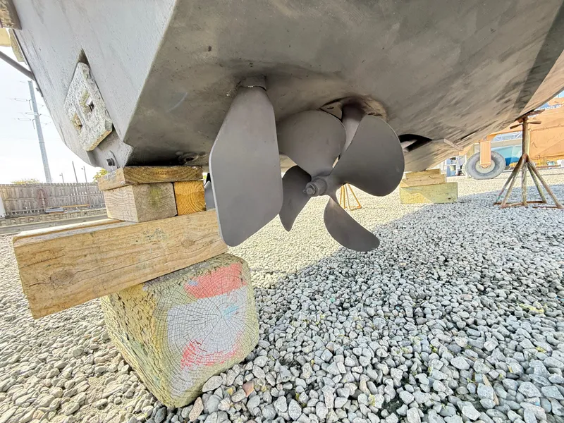 Slide: The Image of Propeller of 2001 Albemarle 280 Express Sport Fisherman on dry dock, supported by wooden blocks. - 42