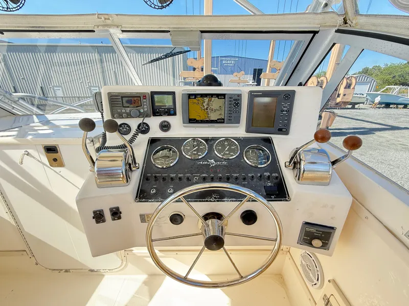Slide: The Image of 2001 Albemarle 280 Express Sport Fisherman helm with gauges, controls, and navigation equipment. - 5