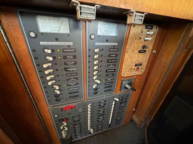 Slide: The Image of Electrical control panel on a 1985 Egg Harbor 37 Convertible boat. - 15