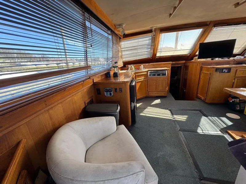 Slide: The Image of Interior of 1985 Egg Harbor 37 Convertible yacht with wood paneling and modern amenities. - 17