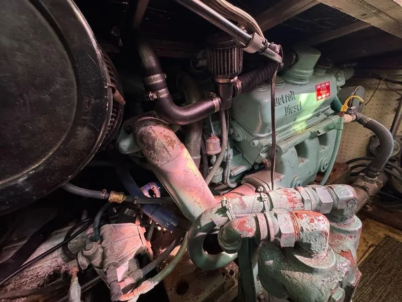 Slide: The Image of Engine room of a 1985 Egg Harbor 37 Convertible boat, featuring a Detroit Diesel engine. - 29