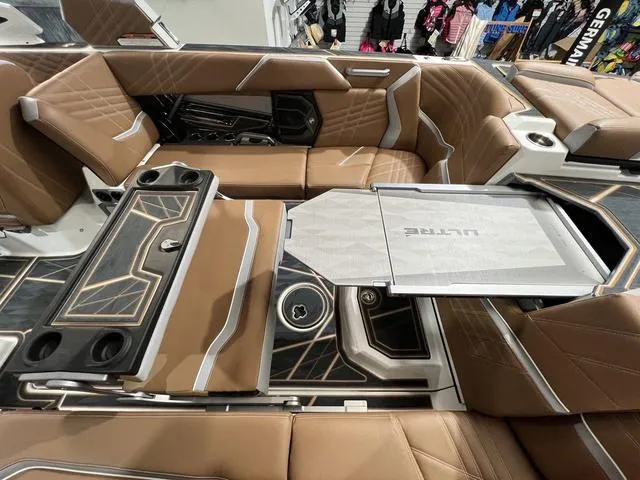 Slide: The Image of Luxurious interior of 2025 Tigé 25ZX boat with brown leather seating and modern design. - 3