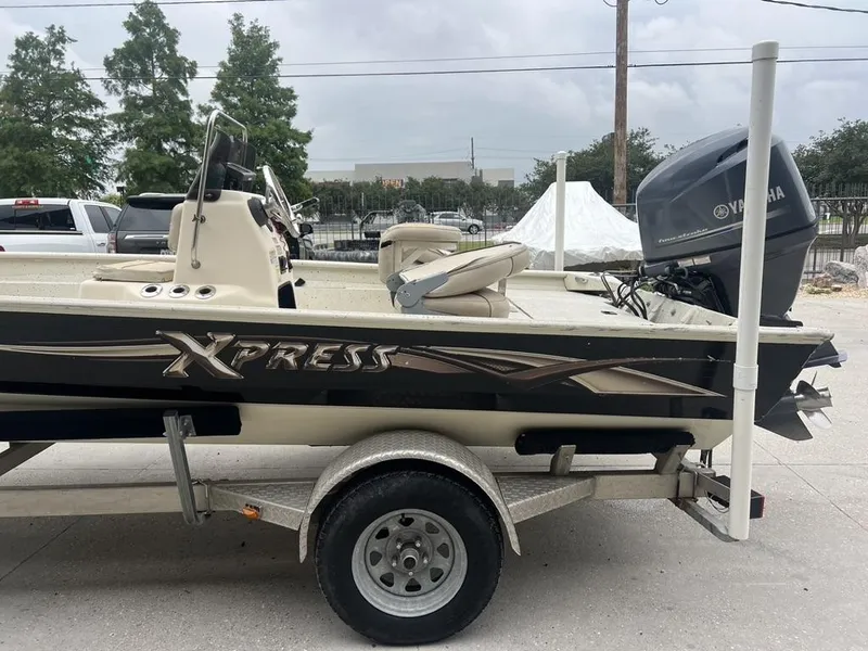 Slide: The Image of 2013 Xpress XP20 CC boat on trailer with Yamaha outboard motor. - 10