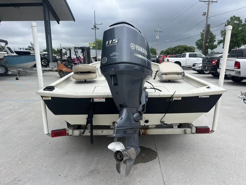 Slide: The Image of 2013 Xpress XP20 CC boat with Yamaha 115 engine, parked outdoors. - 7