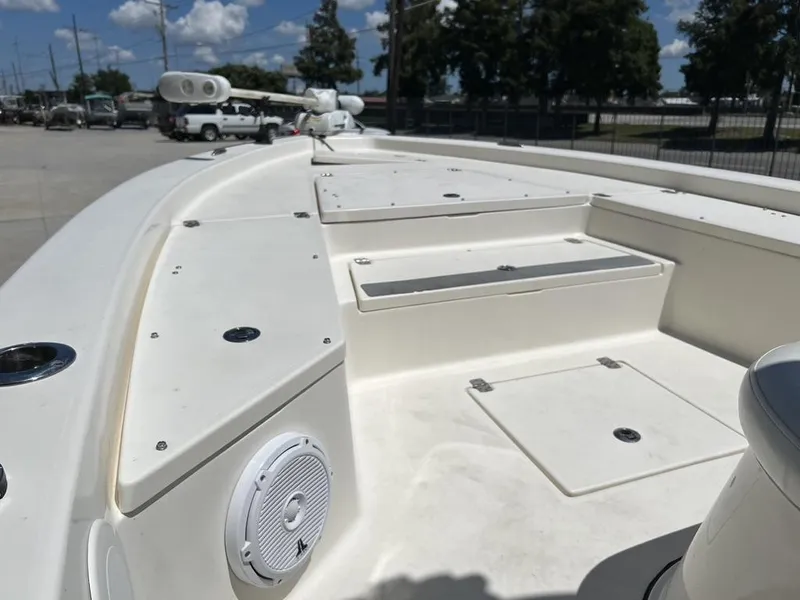 Slide: The Image of Avenger AV 26 boat deck, 2016 model, featuring storage compartments and speaker. - 13