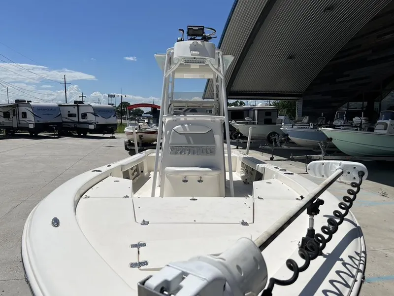Slide: The Image of 2016 Avenger AV 26 boat in a marina, surrounded by RVs and other boats. - 18