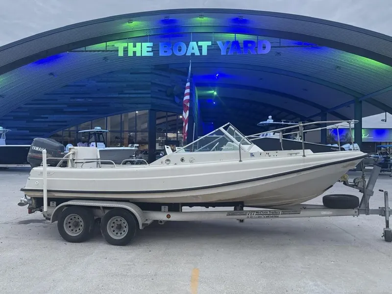 Slide: The Image of 1977 Boston Whaler 21 REVENGE boat on trailer at The Boat Yard. - 1
