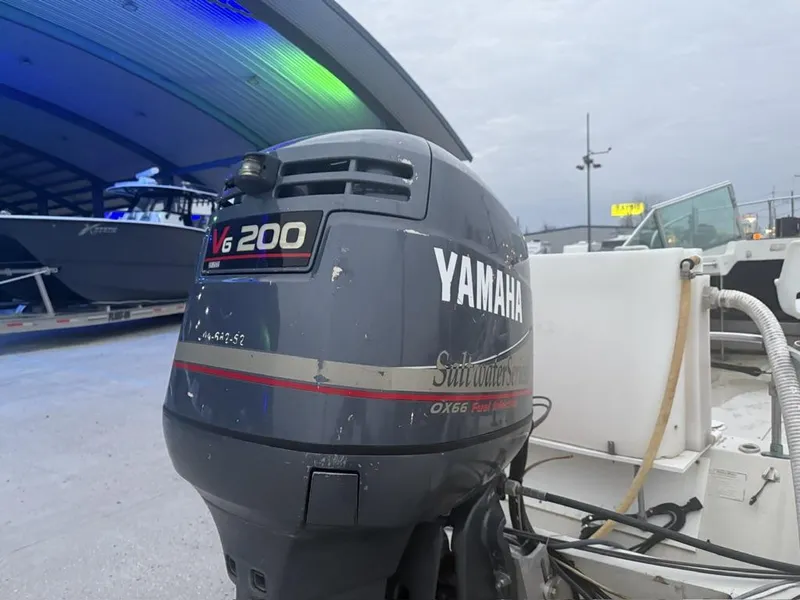 Slide: The Image of Yamaha V6 200 outboard motor on a 1977 Boston Whaler 21 REVENGE boat. - 3