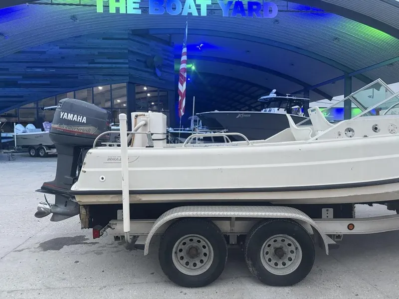 Slide: The Image of 1977 Boston Whaler 21 REVENGE boat on trailer, Yamaha motor, at The Boat Yard. - 8