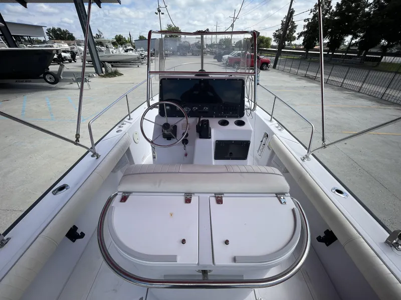 Slide: The Image of 1997 Boston Whaler 21 Outrage boat interior with steering console and seating. - 12