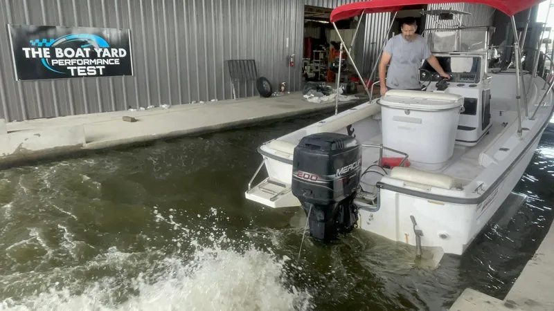 Slide: The Image of 1997 Boston Whaler 21 Outrage undergoing performance test at boat yard. - 16
