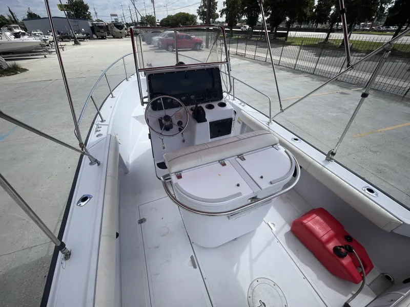 Slide: The Image of 1997 Boston Whaler 21 Outrage boat interior with steering console and seating. - 22
