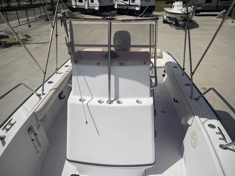 Slide: The Image of 1997 Boston Whaler 21 Outrage boat interior with seating and console. - 7