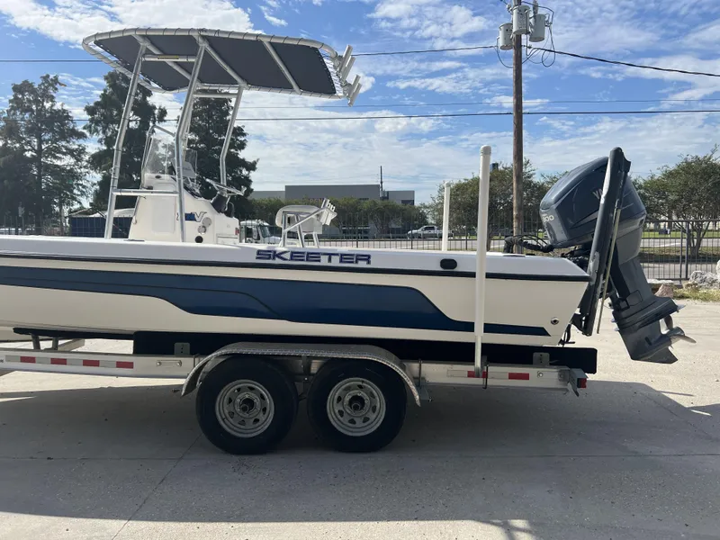 Slide: The Image of 2007 Skeeter ZX 24 Bay boat on trailer, featuring Yamaha outboard motor. - 10