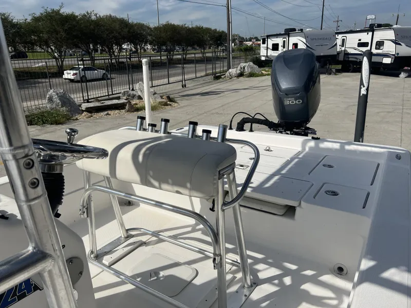 Slide: The Image of 2007 Skeeter ZX 24 Bay boat with Yamaha 300 engine, parked near RVs. - 11