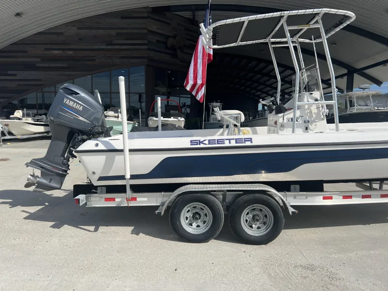 Slide: The Image of 2007 Skeeter ZX 24 Bay boat on trailer with Yamaha outboard motor. - 6