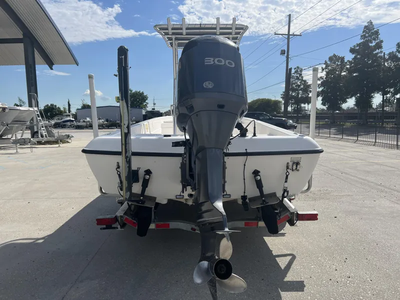 Slide: The Image of 2007 Skeeter ZX 24 Bay boat with 300 HP engine, parked outdoors. - 8