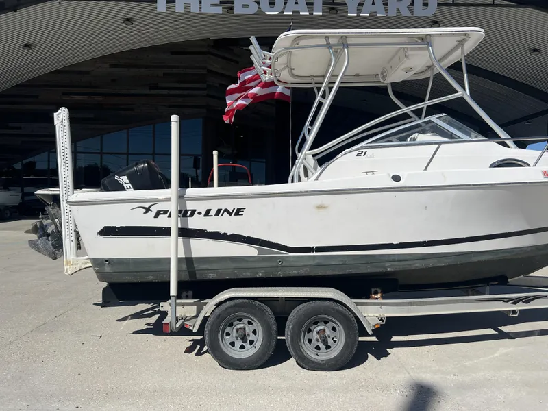 Slide: The Image of 2007 Pro-Line 21 WA boat interior with control panel and storage compartment. - 3