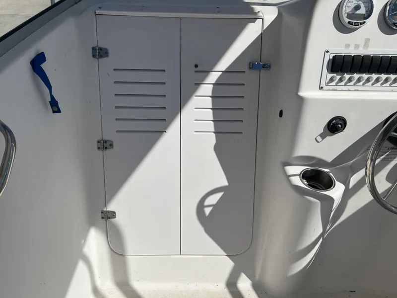 Slide: The Image of 2007 Pro-Line 21 WA boat cockpit with steering wheel and control panel. - 4