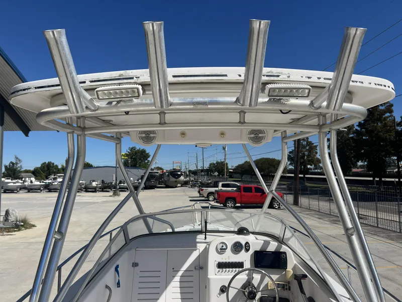 Slide: The Image of 2007 Pro-Line 21 WA boat with Mercury 150 outboard motor in a parking area. - 6