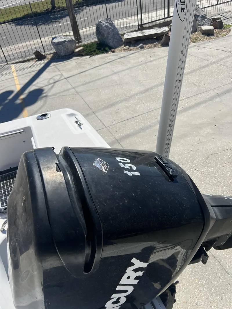 Slide: The Image of 2007 Pro-Line 21 WA boat on trailer with American flag in background. - 7