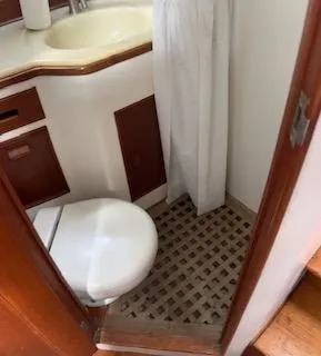 Slide: The Image of Bathroom interior of 1989 Grand Banks GND01 boat with wooden accents. - 18