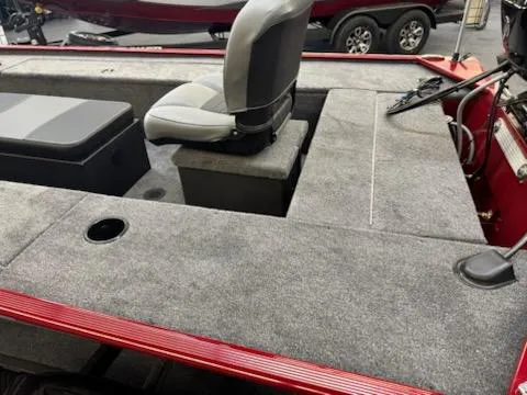 Slide: The Image of 2025 Tracker Panfish 17 boat interior with seating and carpeted deck. - 4