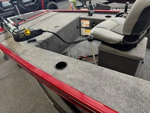 Slide: The Image of 2025 Tracker Panfish 17 boat interior with gray seating and red trim. - 5