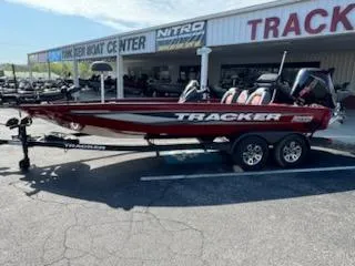 The Image of 2025 Tracker Savage 215 boat on trailer outside dealership. - 0