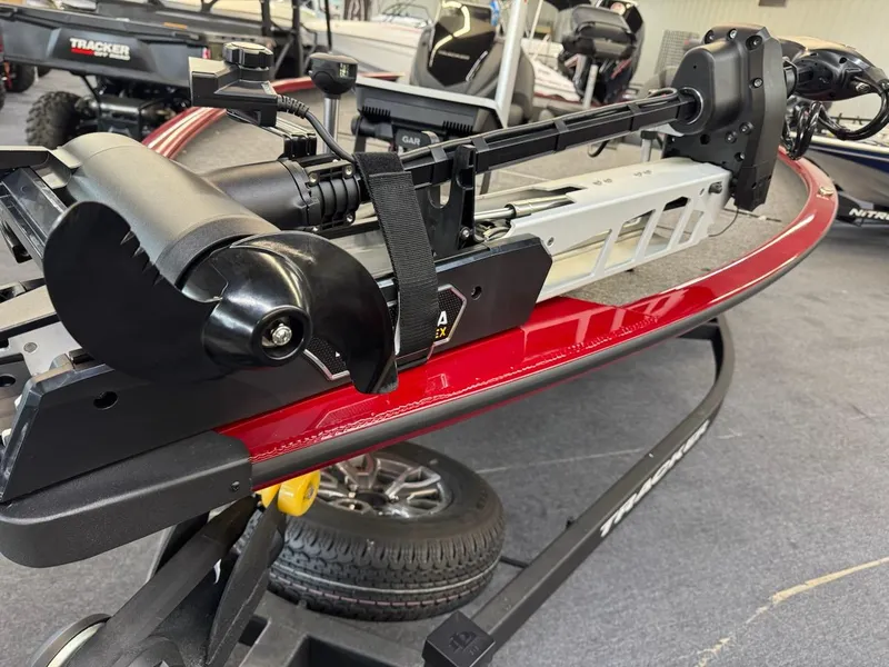 Slide: The Image of 2025 Tracker Savage 215 boat with advanced motor system on display. - 11