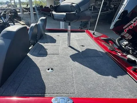 Slide: The Image of 2025 Tracker Savage 215 boat deck with seating and storage compartments. - 4