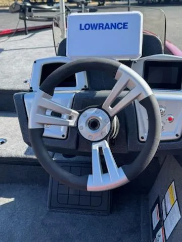 Slide: The Image of Steering wheel of 2025 Tracker Savage 215 boat with Lowrance navigation system. - 8