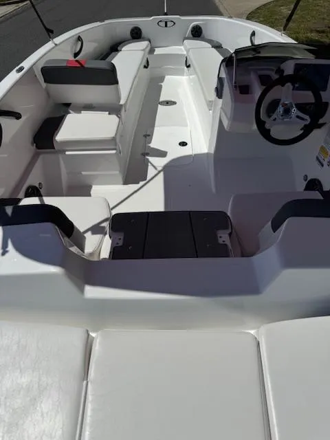 Slide: The Image of 2025 Tahoe T18 boat interior with seating and steering wheel, showcasing modern design. - 10