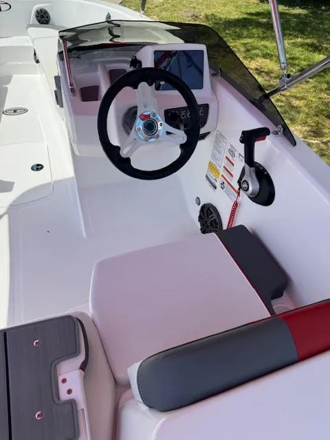 Slide: The Image of 2025 Tahoe T18 boat cockpit with steering wheel and control panel. - 11