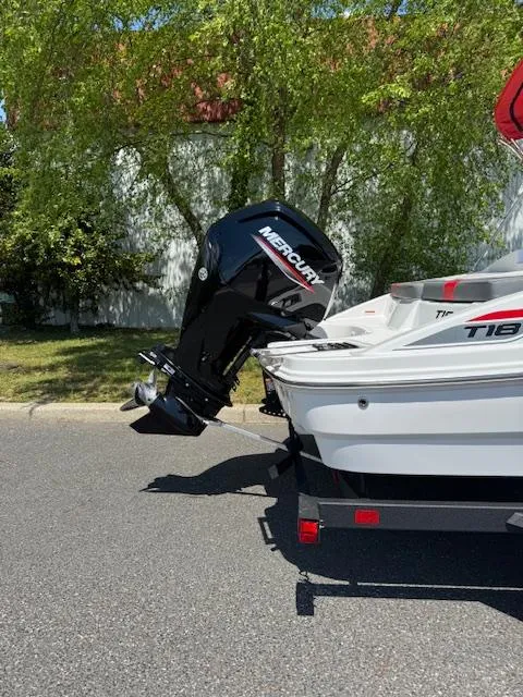 Slide: The Image of 2025 Tahoe T18 boat with Mercury outboard motor on a trailer. - 4