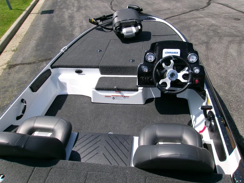 Slide: The Image of 2025 Nitro Z17 boat interior with steering wheel and seating, featuring Lowrance electronics. - 4