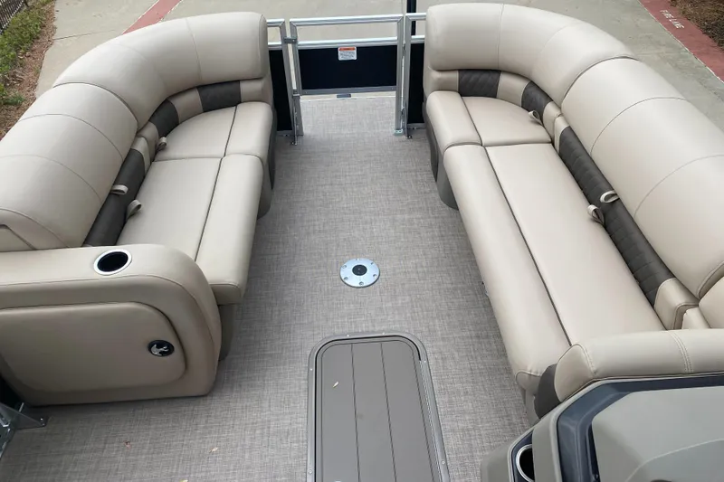Slide: The Image of 2025 Sun Tracker SportFish 22 XP3 interior with beige seating and spacious layout. - 3