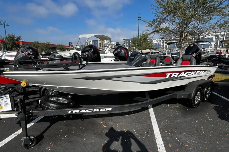 The Image of 2025 Tracker Savage 215 boat on trailer, parked outdoors under clear sky. - 0