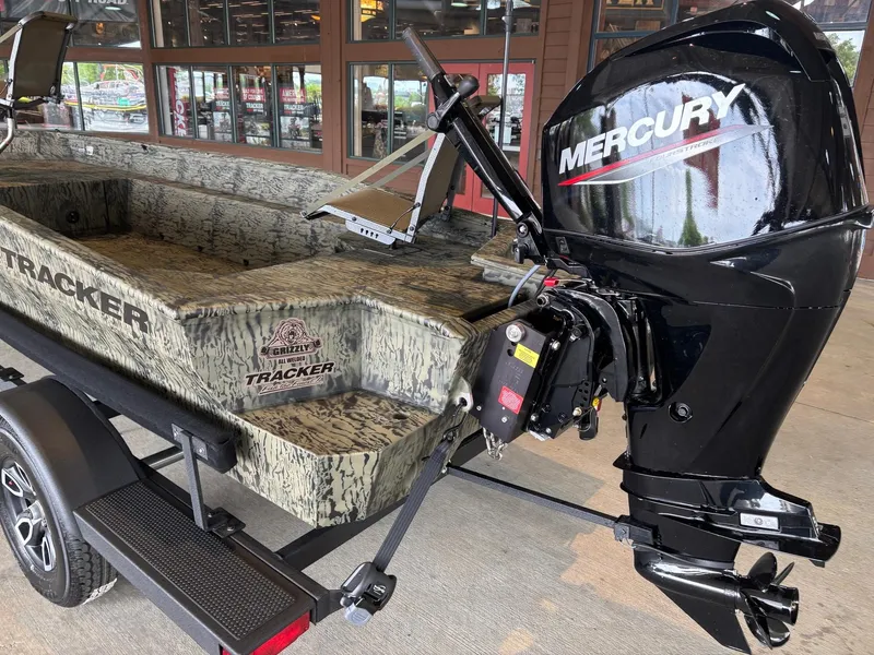 Slide: The Image of 2025 Tracker Grizzly 1650 T Prairie Wings Edition boat with Mercury outboard motor. - 4
