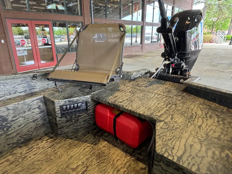 Slide: The Image of 2025 Tracker Grizzly 1650 T Prairie Wings Edition boat with camo design and motor. - 5