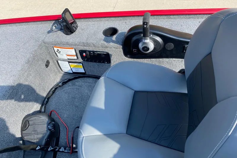 Slide: The Image of 2025 Tracker Panfish 17 boat interior with steering controls and seating. - 5