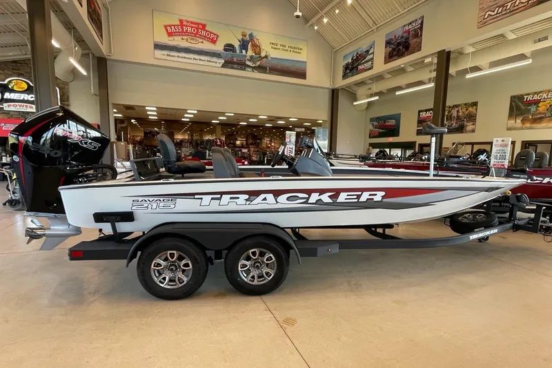 The Image of 2025 Tracker Savage 215 boat displayed indoors at Bass Pro Shops showroom. - 0