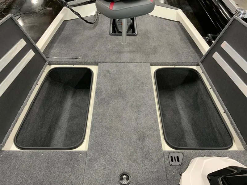 Slide: The Image of 2025 Ranger RT188 boat interior with storage compartments and seating. - 11