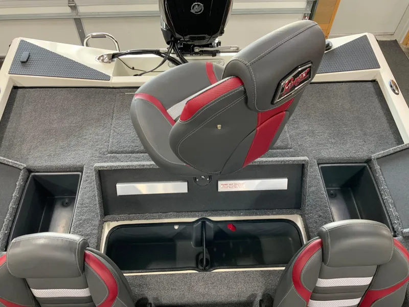 Slide: The Image of 2025 Ranger RT188 boat interior with gray and red seating, storage compartments, and motor. - 12